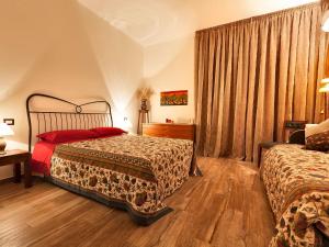 Postel nebo postele na pokoji v ubytování B&B Casa Rossella