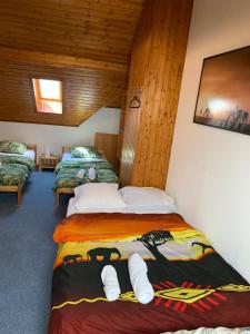 a bedroom with two beds in a room at Appartement duplex in Saint-Louis
