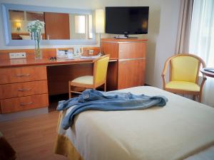 Łóżko lub łóżka w pokoju w obiekcie Hotel Nadmorski
