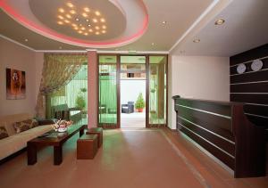 a living room with a couch and a table at Central Plaza in Pomorie