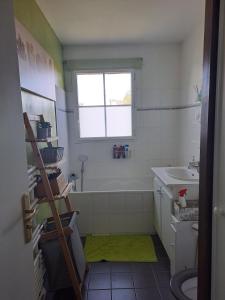 a bathroom with a tub and a sink and a window at Villa individuelle 5 mn Lille centre Chr/eurasante in Haubourdin +20 photos
