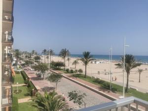 a view of the beach from the balcony of a condo at APARTAMENTO SOL Y MAR Primera Linea in Playa de Gandia