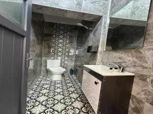 a bathroom with a toilet and a sink at Kosova Hotel in Istanbul