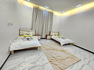 Giường trong phòng chung tại فيلا امين