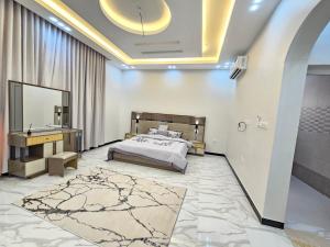 Giường trong phòng chung tại فيلا امين