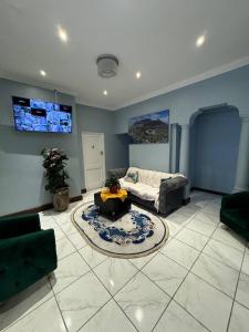 a living room with a couch and a table at Michu Guest house in Cape Town