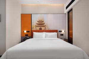 Letto o letti in una camera di Hampton by Hilton Nanjing Xianlin University Town
