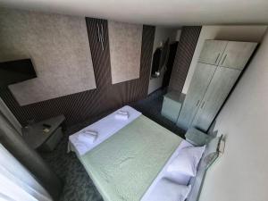Postel nebo postele na pokoji v ubytování Korona Hotel