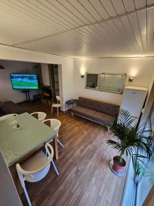 a living room with a couch and a table at VILLAGE SINTRA gh in Sintra