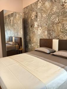 Postel nebo postele na pokoji v ubytování Dojo idro rooms