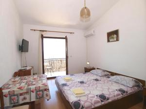 Postel nebo postele na pokoji v ubytování Apartmani Korljan