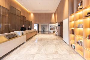 Postel nebo postele na pokoji v ubytování Atour Hotel Changsha Wanjiali Middle Road Gaoqiao North