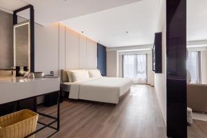 Postel nebo postele na pokoji v ubytování Atour Hotel Changsha Wanjiali Middle Road Gaoqiao North