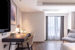 TV a/nebo společenská místnost v ubytování Atour Hotel Changsha Wanjiali Middle Road Gaoqiao North