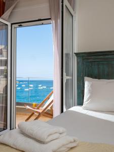 Ένα ή περισσότερα κρεβάτια σε δωμάτιο στο Omnia Apartments