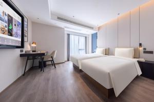 Postel nebo postele na pokoji v ubytování Atour Hotel Changsha Wanjiali Middle Road Gaoqiao North