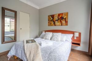 Cama ou camas em um quarto em Imperial Inn Hospedaje Turistico