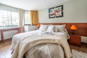Cama ou camas em um quarto em Imperial Inn Hospedaje Turistico