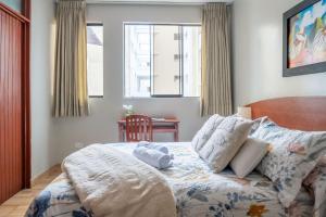 Cama ou camas em um quarto em Imperial Inn Hospedaje Turistico