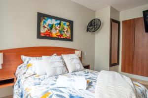Cama ou camas em um quarto em Imperial Inn Hospedaje Turistico