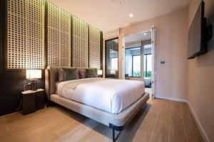 Ένα ή περισσότερα κρεβάτια σε δωμάτιο στο Moon 5-Bedroom Luxury Pool Villa