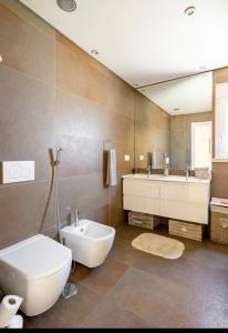 a bathroom with a toilet and a tub and a sink at Feel Like Your Home in Montijo +44 photos