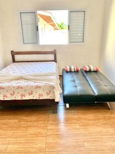 Postel nebo postele na pokoji v ubytování Kitnet do Sossego