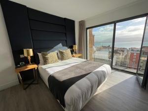 Cama ou camas em um quarto em Hotel Art Santander