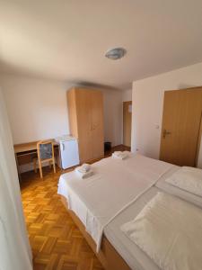 Katil atau katil-katil dalam bilik di Apartments and Rooms Mamić