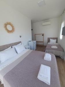 A bed or beds in a room at Adil Pansiyon