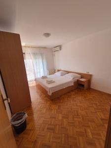 Katil atau katil-katil dalam bilik di Apartments and Rooms Mamić
