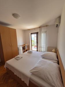 Katil atau katil-katil dalam bilik di Apartments and Rooms Mamić