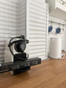 a tea kettle sitting on top of two boxes at Petra Mare Apartments in Alyki