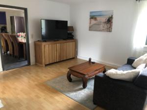 a living room with a couch and a coffee table at Wittlicher Monteuren - Ferienwohnung in Platten