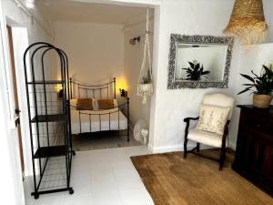 a room with two bunk beds and a chair at Ibizan Style Studio in Jesús in Nuestra Señora de Jesus