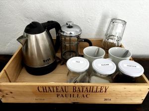 a wooden tray with a coffee maker and cups at Ibizan Style Studio in Jesús in Nuestra Señora de Jesus