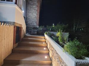 a stairway with lights on the side of a house at night at Belle paimpolaise à 100m du port in Paimpol +13 photos
