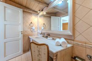a bathroom with a sink and a mirror at Platanias Memories Apartment in Platanias +47 photos