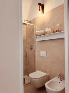 a bathroom with a shower and a toilet and a sink at La dimora del faro in Bari +29 photos