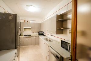 Kuchyň nebo kuchyňský kout v ubytování L'Hostalet GuestHouse