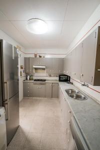 Kuchyň nebo kuchyňský kout v ubytování L'Hostalet GuestHouse