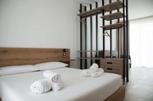 Postel nebo postele na pokoji v ubytování Montedarena Hotel