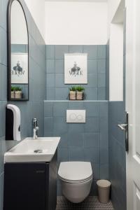 a bathroom with a toilet and a sink at Villa Jozefina - Istria in Hreljići