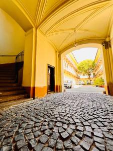 an archway in a building with a cobblestone street at Comfy Luxury Apartment with 2 rooms in the City Centre AA in Budapest +9 photos