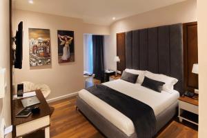 Postel nebo postele na pokoji v ubytování Arberia Palace Hotel