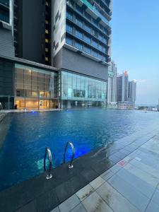 a swimming pool in the middle of a city at Foo homestay @setia sky88 in Johor Bahru