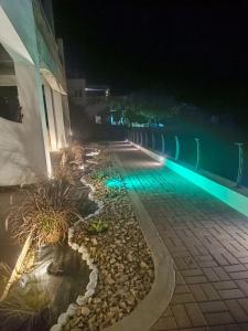 an empty street at night with blue lights at VAYAL SKYROS in Skiros