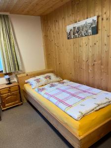 Postel nebo postele na pokoji v ubytování Haus Waldegg 84
