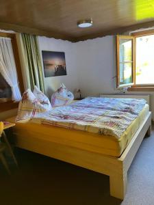 Postel nebo postele na pokoji v ubytování Haus Waldegg 84