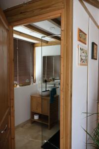 a bathroom with a sink and a mirror at Studio Avec jardin privé in Bergerac +7 photos
